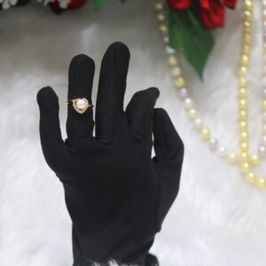 Pearl Ring with Heart Design - A charming pearl ring featuring a radiant pearl framed by a delicate heart motif, symbolizing love and timeless elegance.