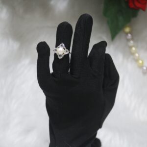Pearl Ring with Floral Design - A stunning pearl ring featuring a delicate floral-inspired design, perfect for adding elegance and charm to any look.