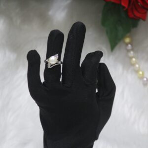 Pearl Ring with Intricate Design - A beautifully crafted ring featuring a luminous pearl surrounded by detailed and artistic metalwork for a luxurious look.