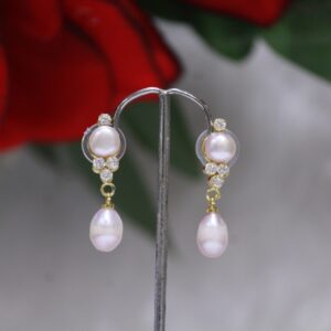 Pearl Drop Earrings with Teardrop and Cluster Design - Elegant earrings featuring a teardrop pearl and a sparkling gemstone cluster for a sophisticated look.