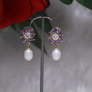 Pearl Drop Earrings with Purple Stone Flower Design - Elegant earrings featuring a radiant pearl drop paired with a vibrant purple stone flower motif.
