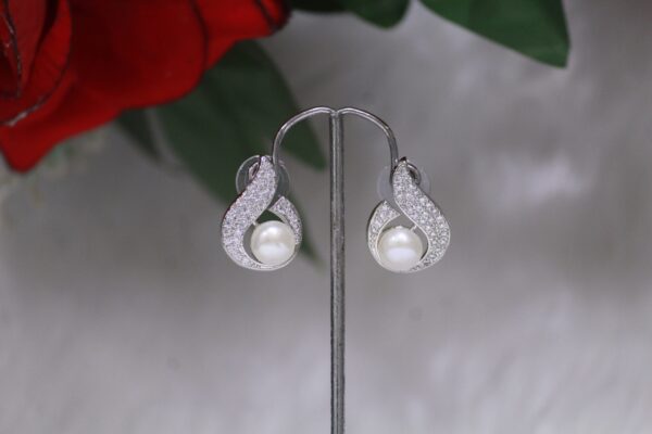 Pearl Stud Earrings - Classic and elegant pearl studs for a timeless look.