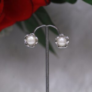 Pearl Stud Earrings with Flower Design - Elegant pearl studs featuring a delicate floral pattern, perfect for weddings, parties, and everyday elegance.
