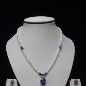 Pearl and Blue Stone Necklace Set - A graceful necklace featuring luminous pearls and radiant blue stone accents, paired with matching earrings for timeless elegance.