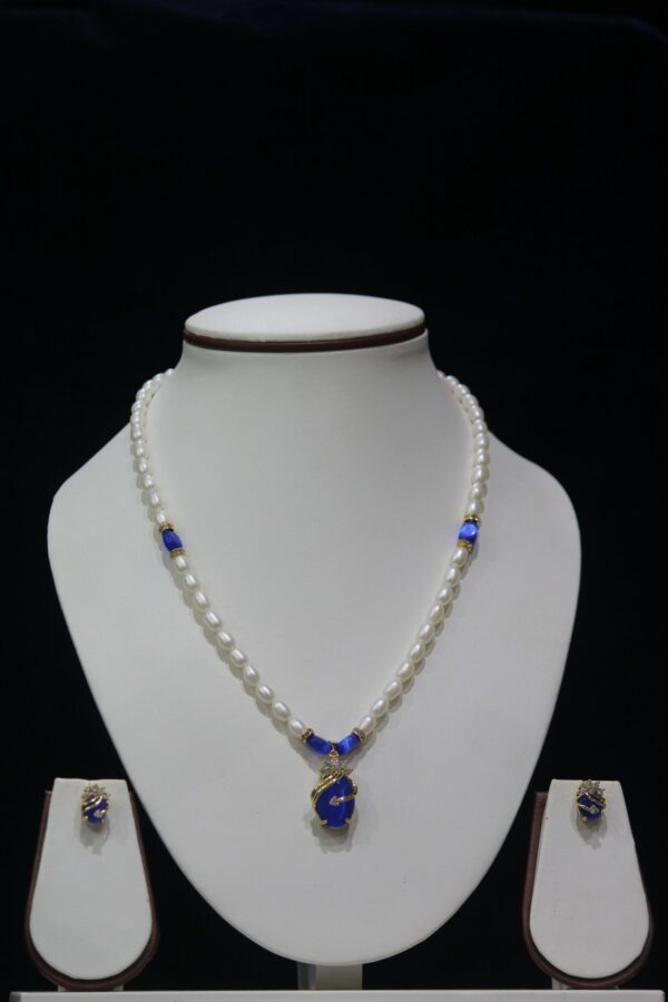 Pearl and Blue Stone Necklace Set - A graceful necklace featuring luminous pearls and radiant blue stone accents, paired with matching earrings for timeless elegance.