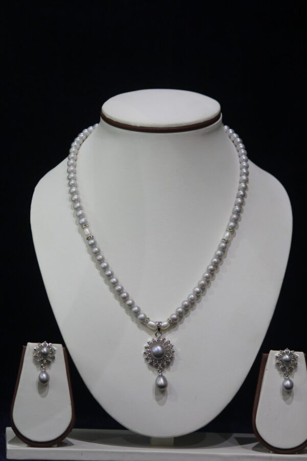 Grey Pearl Necklace Set with Flower Pendant - Elegant grey pearls paired with a delicate flower-shaped pendant for a sophisticated and timeless look.