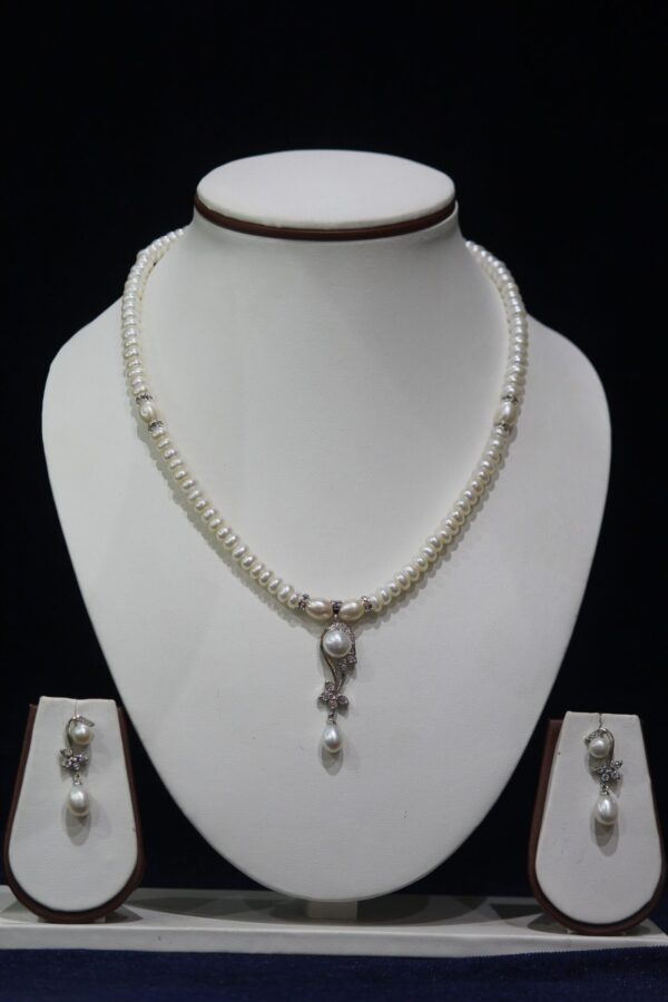 Pearl Necklace Set with Teardrop Pendant - A stunning pearl necklace set featuring a graceful teardrop-shaped pendant, perfect for adding elegance to any outfit.