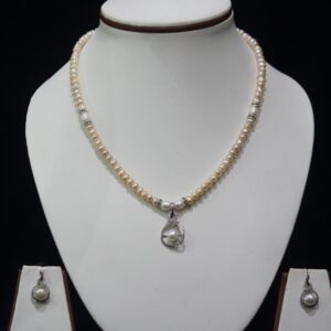 Pearl Necklace Set with Heart-Shaped Pendant - A stunning pearl necklace set featuring a delicate heart-shaped pendant, symbolizing love and elegance.