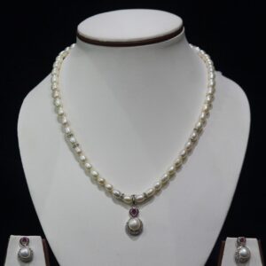 Pearl Necklace Set with Ruby Pendant - A luxurious pearl necklace set featuring a stunning ruby pendant for a sophisticated and elegant look.