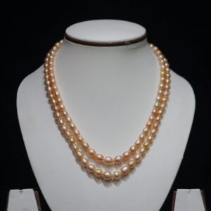 Two-Layered Golden Pearl Necklace Set - A luxurious two-layered necklace set featuring stunning golden pearls for a sophisticated and refined look.