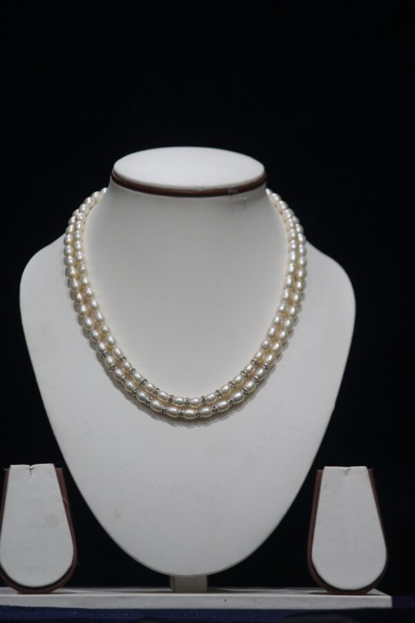 Two-Layered Pearl Necklace Set - A sophisticated two-layer pearl necklace set that combines timeless elegance with modern design for any special occasion.