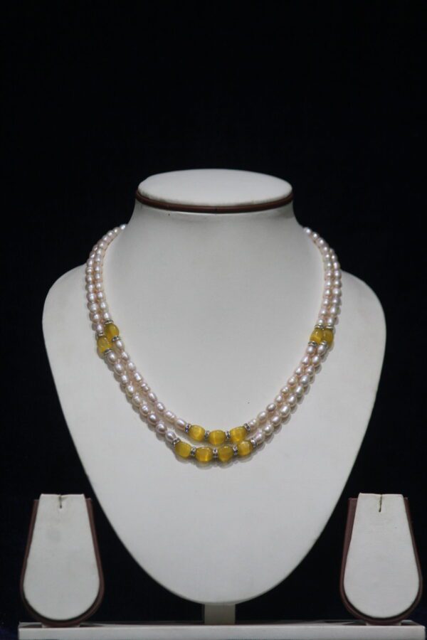 Pearl Necklace Set with Yellow Stone Accents - A refined and elegant pearl necklace set featuring vibrant yellow stone accents, perfect for adding a touch of color to your look.