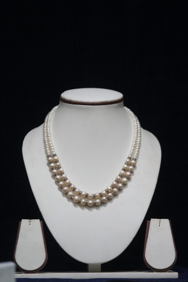 Two-Layered Pearl Necklace Set - A stunning double-layer pearl necklace that offers a sophisticated and elegant look, perfect for any formal or casual occasion.