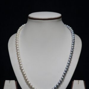 Two-Tone Pearl Necklace Set - A sophisticated jewelry set featuring a blend of light and dark pearls, offering a unique and modern twist on classic elegance.