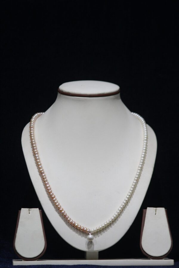 Two-Tone Pearl Necklace Set - A sophisticated jewelry set featuring a blend of two-tone pearls, offering a modern twist on classic elegance.