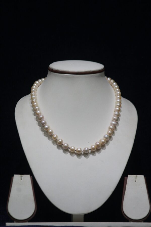 Pearl Necklace Set - A classic and elegant jewelry set featuring lustrous pearls, perfect for adding timeless sophistication to any outfit.