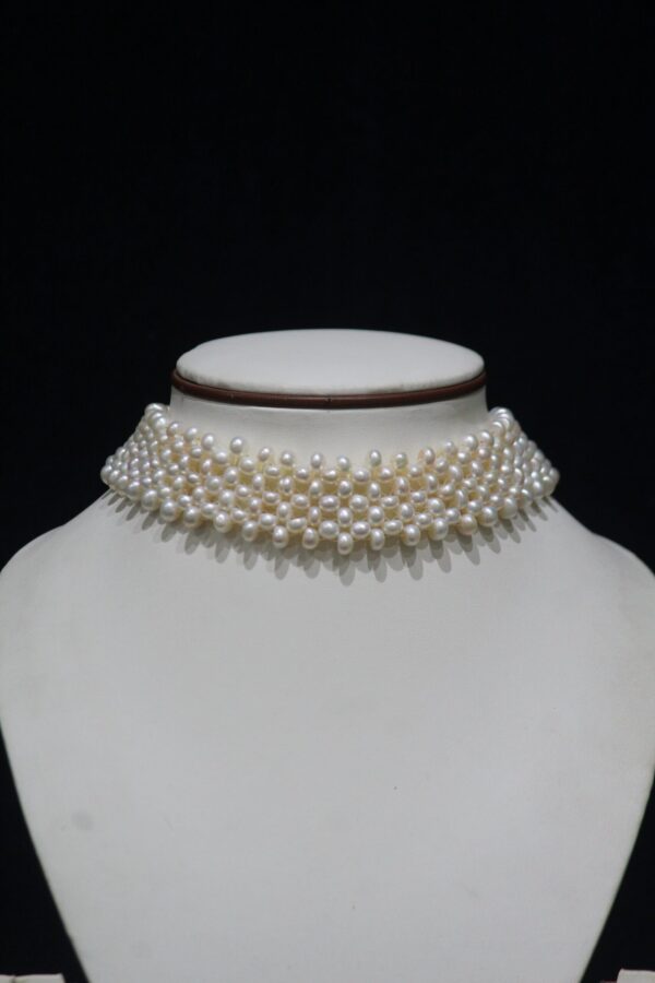 Pearl Choker Necklace - A sophisticated choker featuring lustrous pearls, designed for a timeless and elegant look suitable for any occasion.