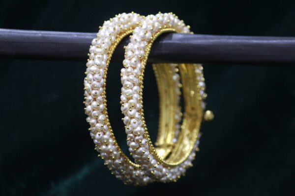 Classical pearl bangle set with elegant design.