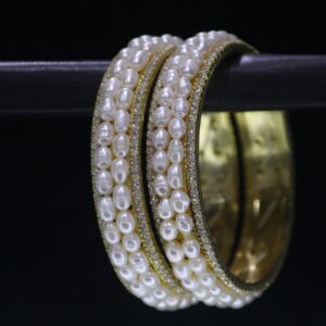 Luxury pearl bangle designed with radiant pearls and an elegant finish, offering a sophisticated touch to any outfit.