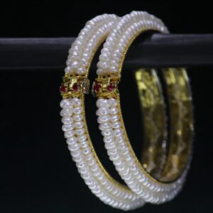 Pearl bangle set with stone accents featuring shimmering pearls complemented by sparkling gemstones, perfect for adding elegance and charm to your outfit.