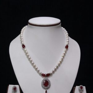 Pearl necklace set with a vibrant ruby pendant, featuring lustrous pearls and an exquisite design for timeless sophistication and elegance.