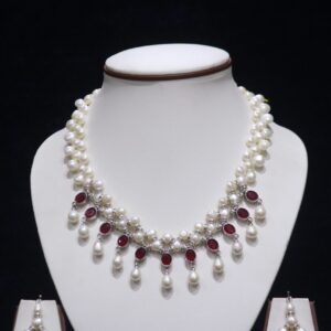 Pearl necklace set with ruby accents for a luxurious and elegant look.