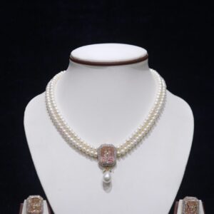 Two-layered pearl necklace set with a stunning pink stone pendant for an elegant look.