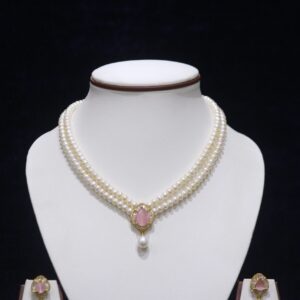 Two-layered pearl necklace set with a pink stone pendant, combining the timeless elegance of pearls with the delicate charm of a pink gemstone.