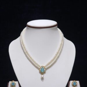 Two-layered pearl necklace set with a sky blue stone pendant, combining the classic elegance of pearls with the serene beauty of a sky blue gemstone.