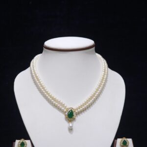 Two-layered pearl necklace set with an emerald pendant, featuring a perfect blend of classic pearls and a luxurious emerald accent.