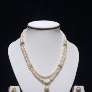 Two-layered pearl necklace set with a pearl pendant, designed for timeless elegance and sophistication, perfect for any occasion.