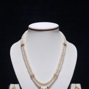 Stunning two-layered pearl necklace set with a beautiful pendant, perfect for adding elegance to any outfit.
