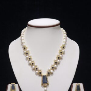 Elegant pearl necklace set with a beautiful blue stone pendant, adding a touch of color and sophistication to any outfit.