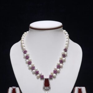 Elegant pearl necklace set with a stunning ruby pendant, perfect for adding a touch of luxury to any occasion.
