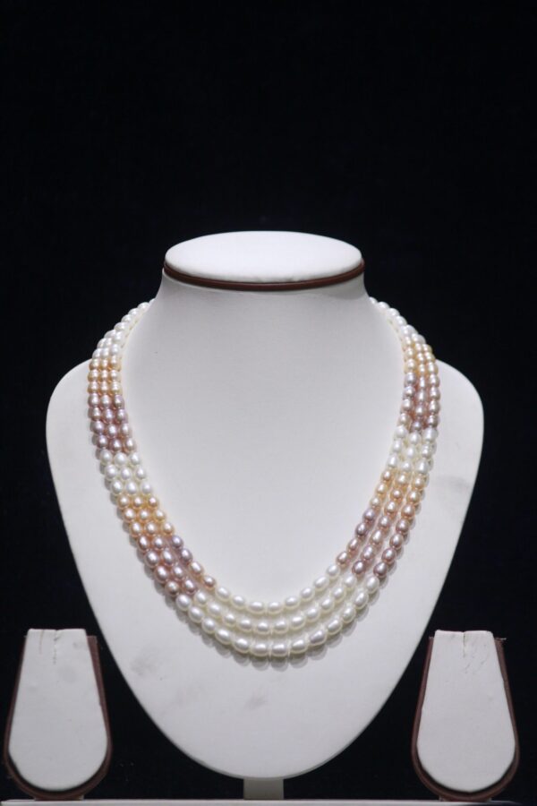Three-layered multicolor pearl necklace set featuring vibrant pearls for a bold and stylish look.