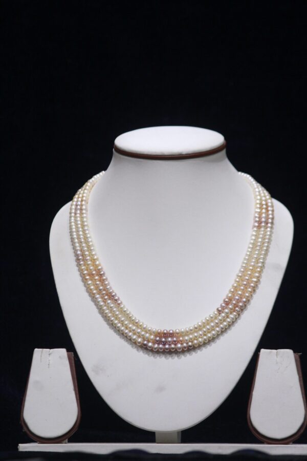 Three-layered multicolor pearl necklace set featuring vibrant pearls arranged in a stunning layered design for a sophisticated and unique look.