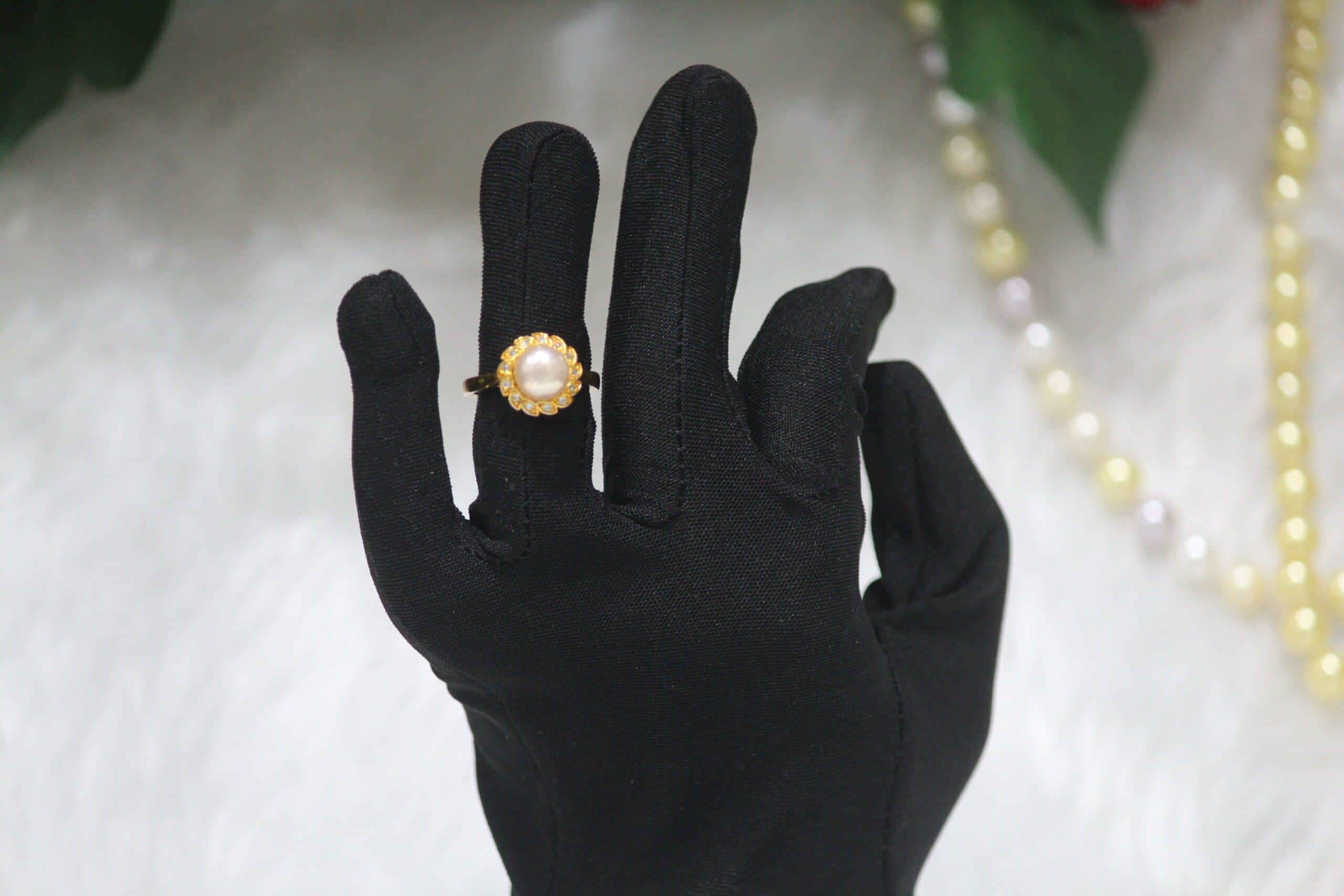 Pearl Ring with Floral Design - Elegant pearl ring featuring a delicate floral pattern, blending timeless sophistication with nature-inspired charm.