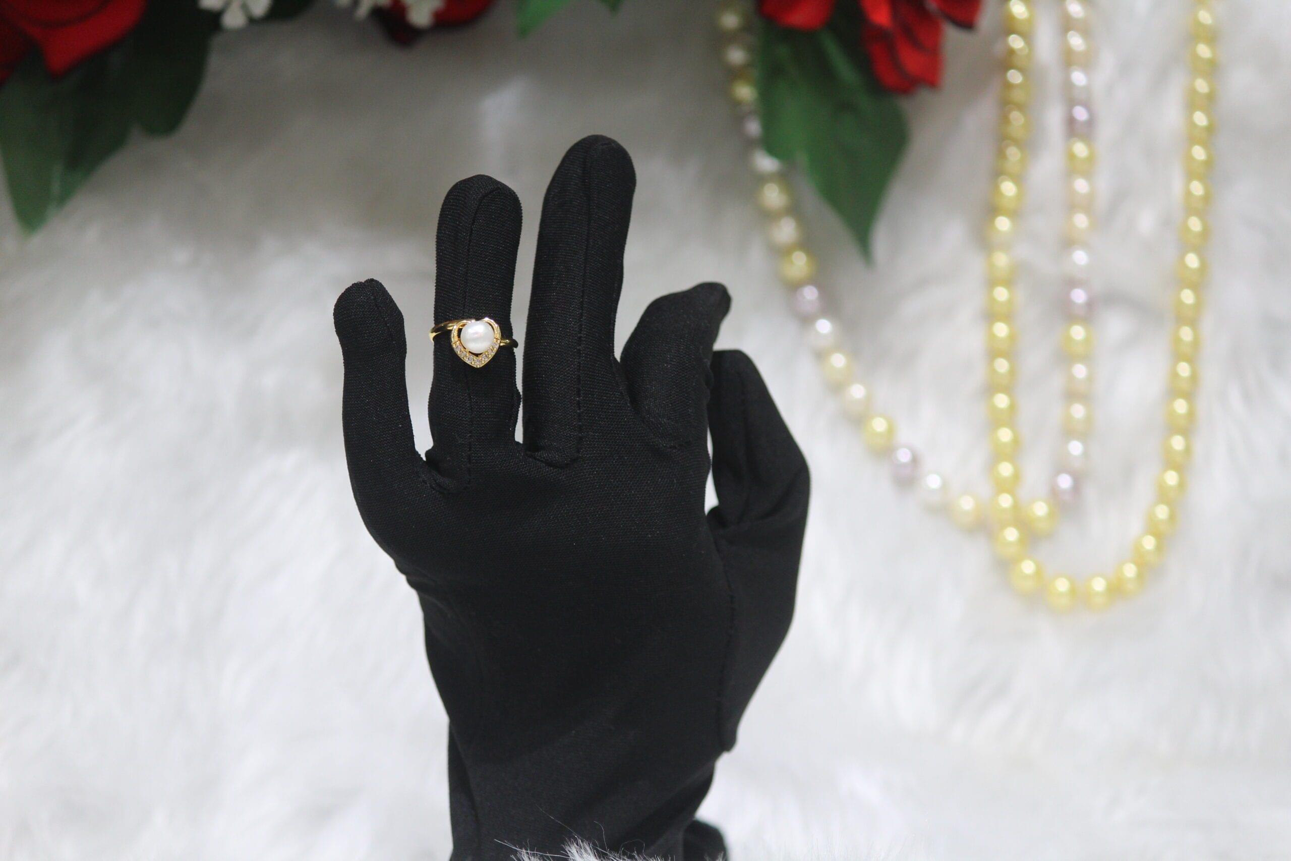 Pearl Ring with Heart Design - A charming pearl ring featuring a radiant pearl framed by a delicate heart motif, symbolizing love and timeless elegance.