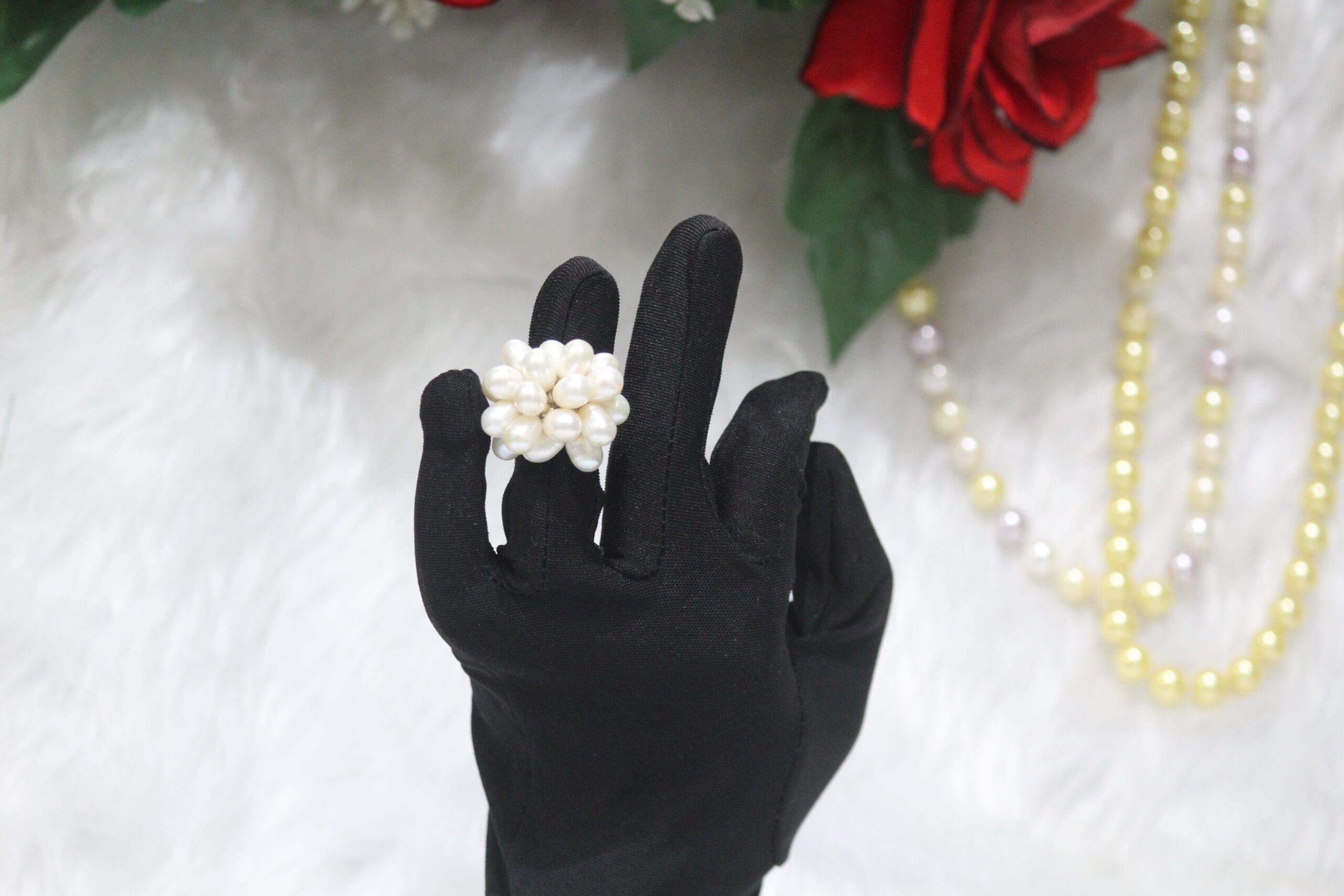 Pearl Cluster Ring - A dazzling ring featuring a cluster of luminous pearls, embodying timeless elegance and a sophisticated design for every occasion.