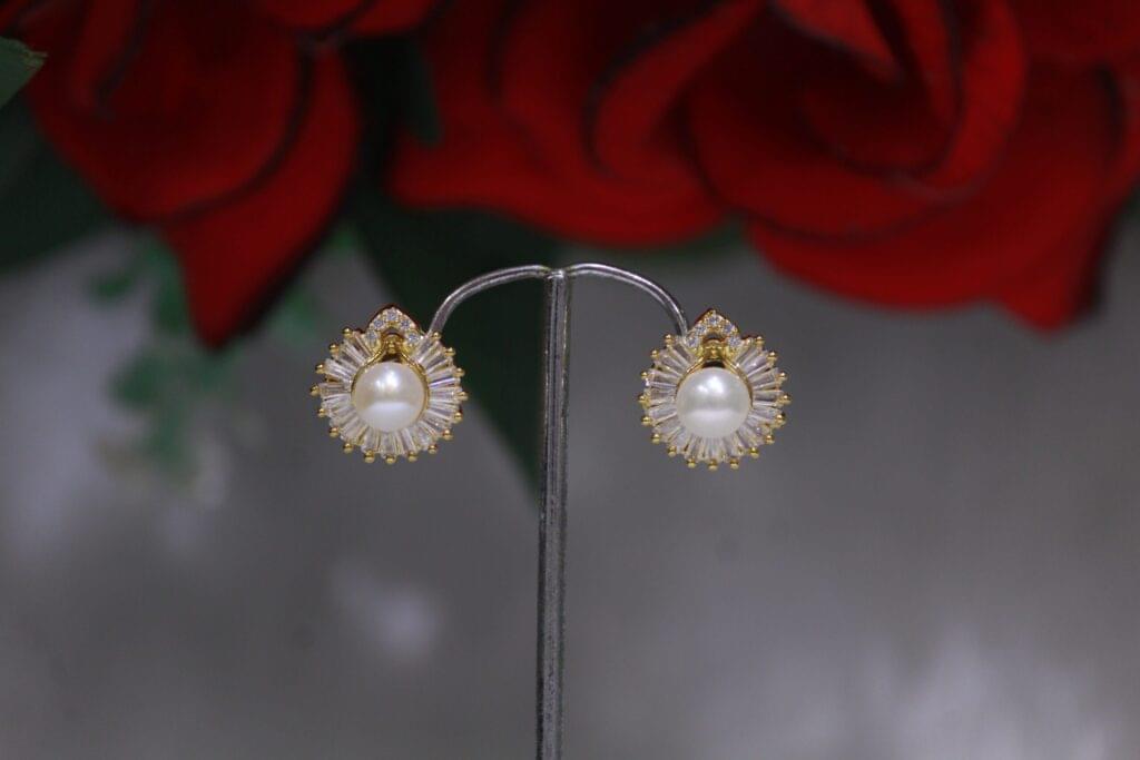 Pearl Stud Earrings with Crystal Halo - Elegant pearl studs surrounded by a sparkling crystal halo for a timeless and sophisticated design.
