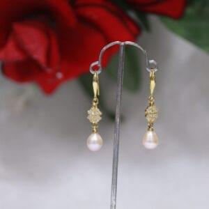 Pearl Drop Earrings with Crystal Ball Design - Elegant pearl drops paired with a stunning crystal ball for a timeless and sophisticated look.