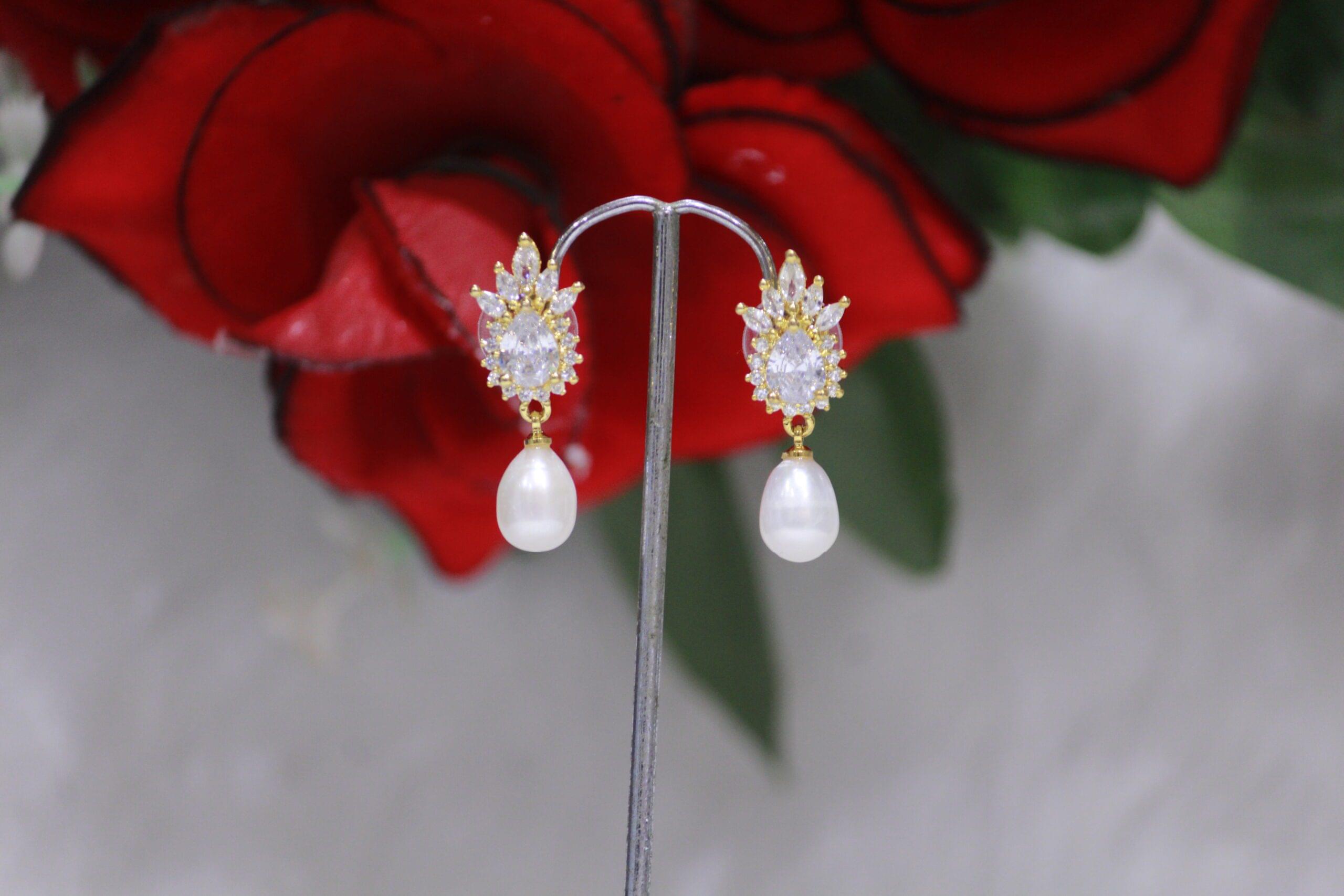 Pearl Drop Earrings with Crystal Cluster Design - Elegant pearl drops featuring a stunning crystal cluster design for a sparkling, timeless look.