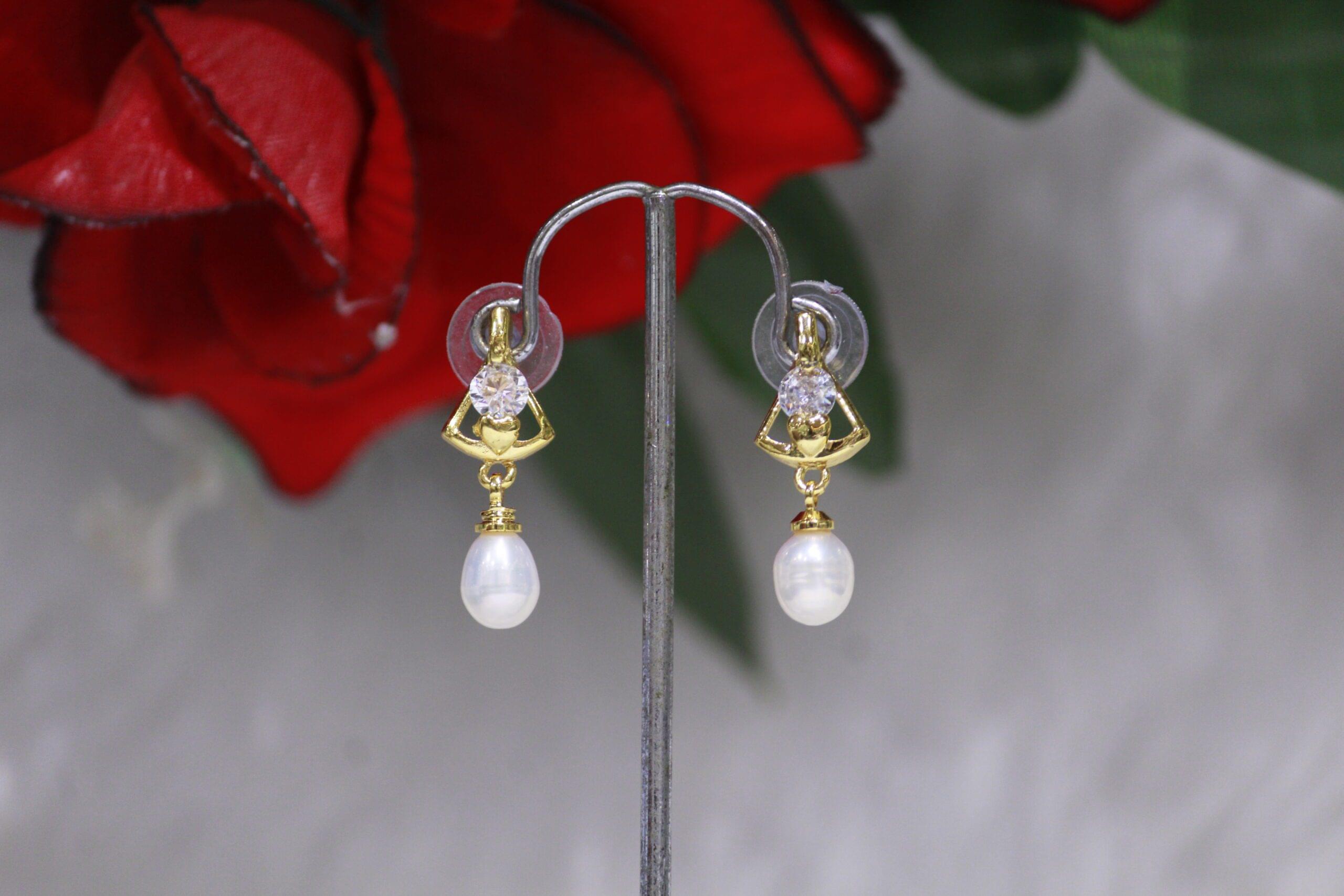 Pearl Drop Earrings with Crystal Figure Design - Elegant pearl drops with a sparkling crystal figure design for a sophisticated and timeless look.
