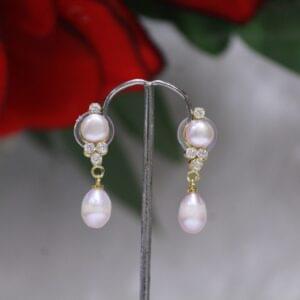 Pearl Drop Earrings with Teardrop and Cluster Design - Elegant earrings featuring a teardrop pearl and a sparkling gemstone cluster for a sophisticated look.