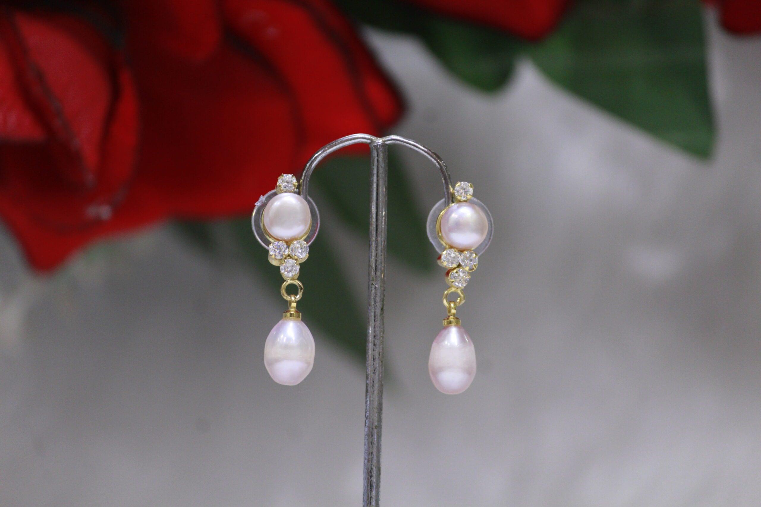 Pearl Drop Earrings with Teardrop and Cluster Design - Elegant earrings featuring a teardrop pearl and a sparkling gemstone cluster for a sophisticated look.