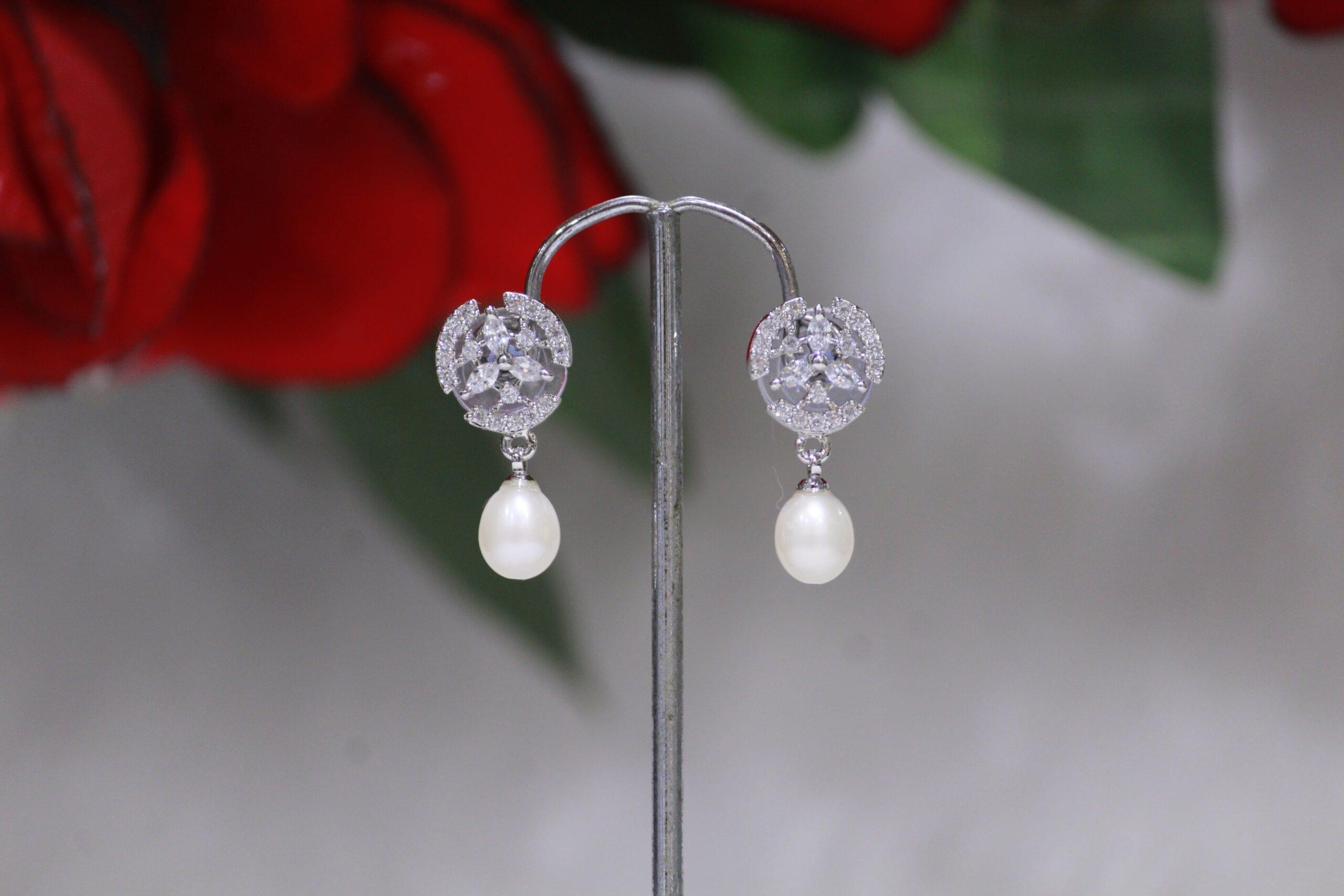 Pearl Drop Earrings with Circular Design - Elegant earrings featuring a radiant pearl drop and a sleek circular design, perfect for timeless sophistication.