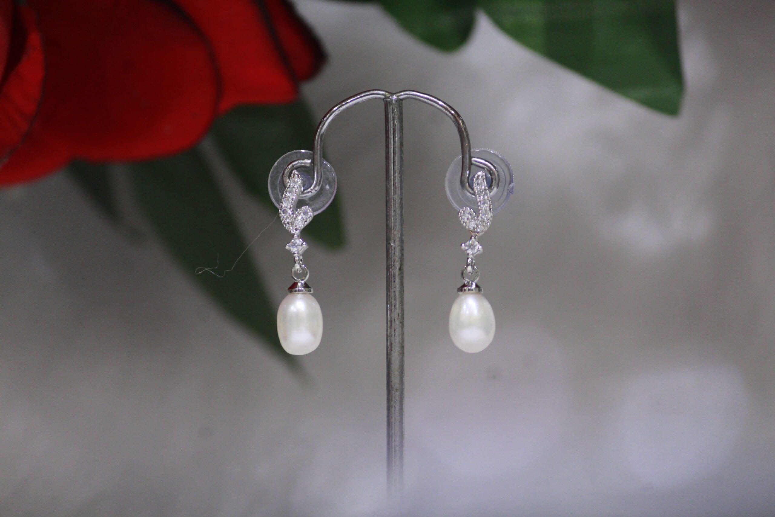Pearl Drop Earrings with Teardrop Design - Elegant earrings featuring radiant pearl drops and a delicate teardrop framework for timeless and graceful appeal.