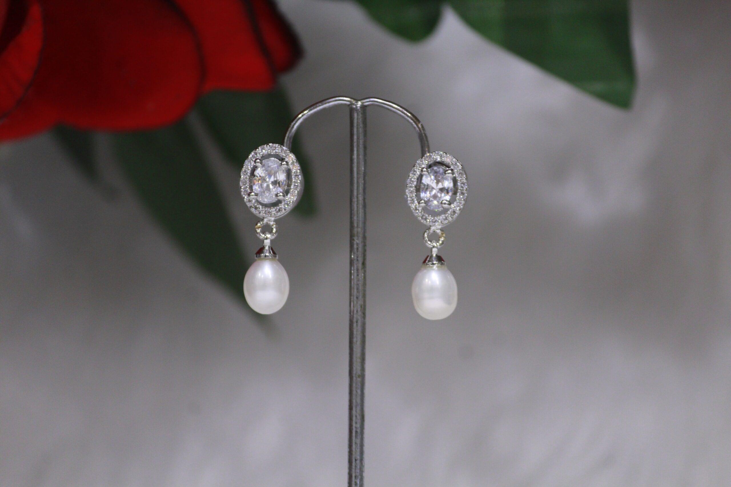 Pearl Drop Earrings with Oval Design - Elegant earrings featuring radiant pearl drops and a sophisticated oval design, perfect for timeless and stylish looks.