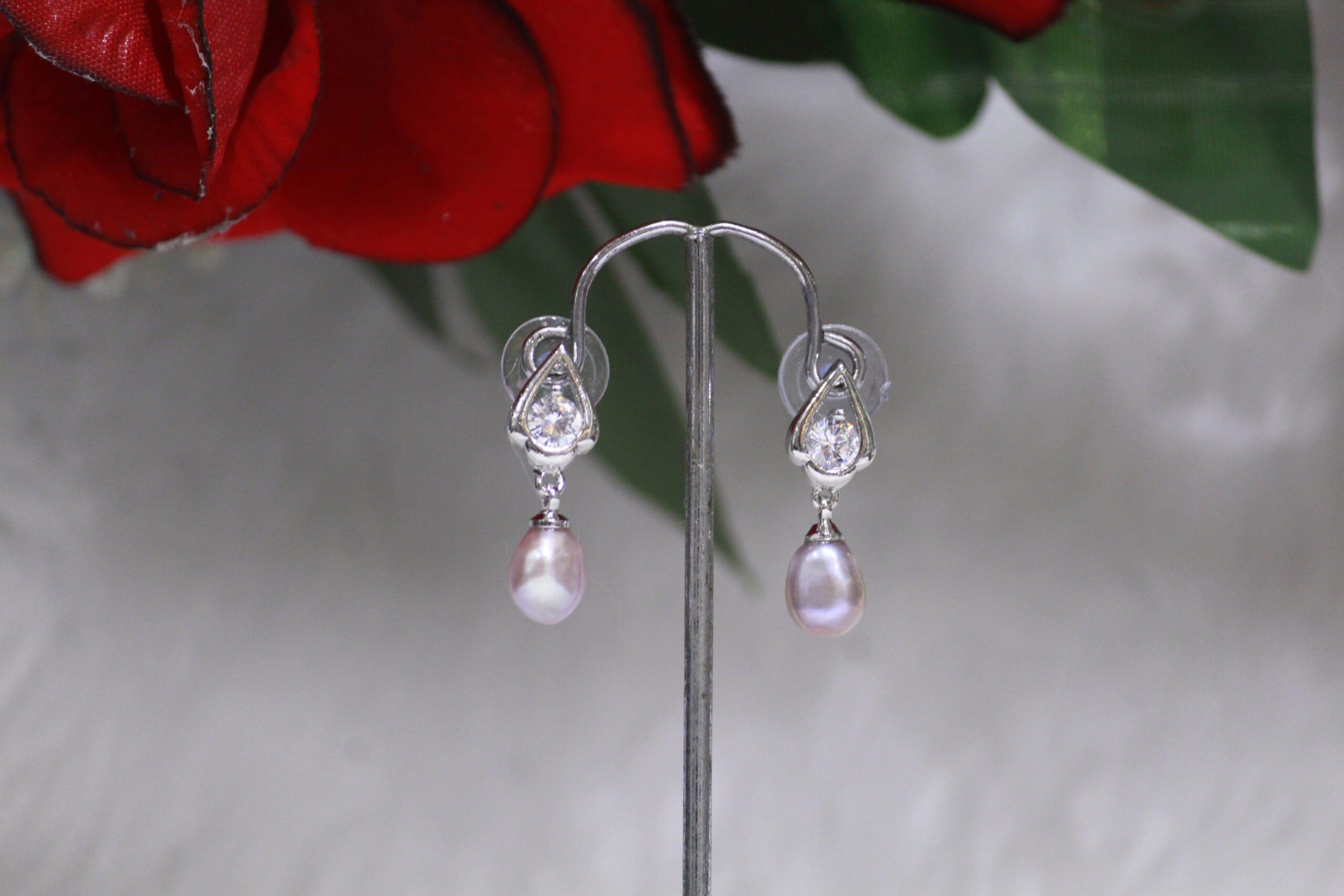 Pearl Drop Earrings with Teardrop Design - Elegant pearl drop earrings featuring a classic teardrop design for a timeless and versatile style.