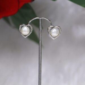 Pearl Stud Earrings with Heart Design - Elegant pearl stud earrings featuring a charming heart-shaped design for a timeless and romantic look.